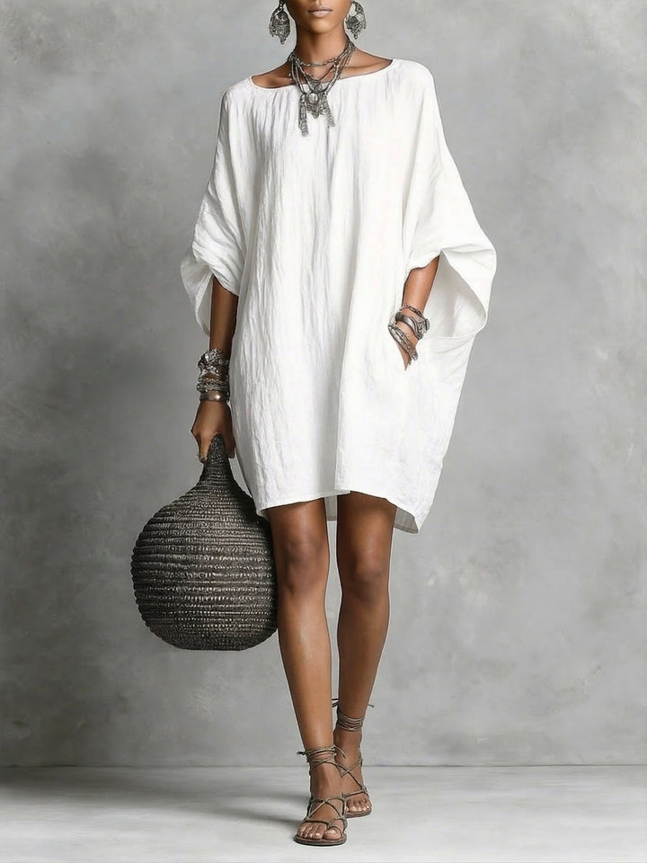 Robe femme décontractée fluide, parfaite pour les vacances d'été. Confort et élégance assurés au quotidien.