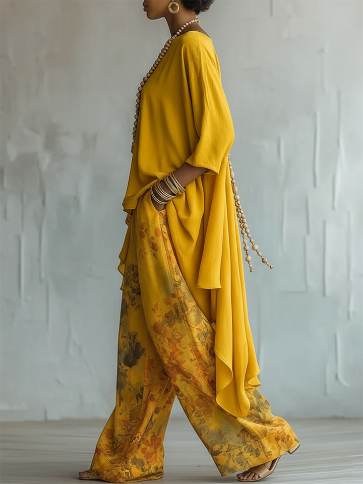Pantalon floral fluide et léger, associé à un haut asymétrique, ensemble bohème femme pour un confort élégant en été.