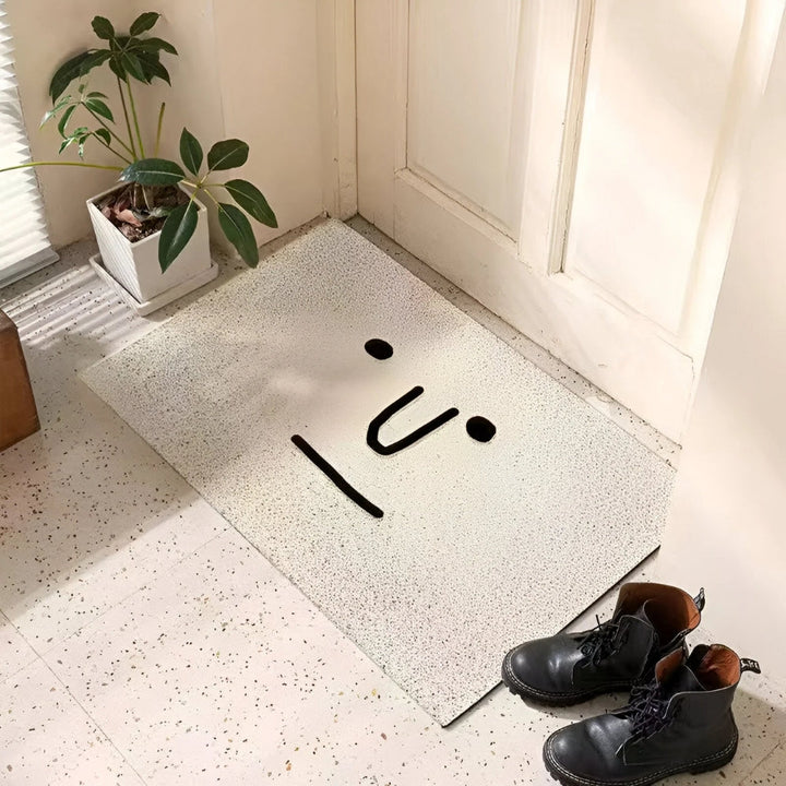Paillasson smiley jaune ludique et antidérapant, parfait pour un accueil joyeux à l'entrée de la maison.