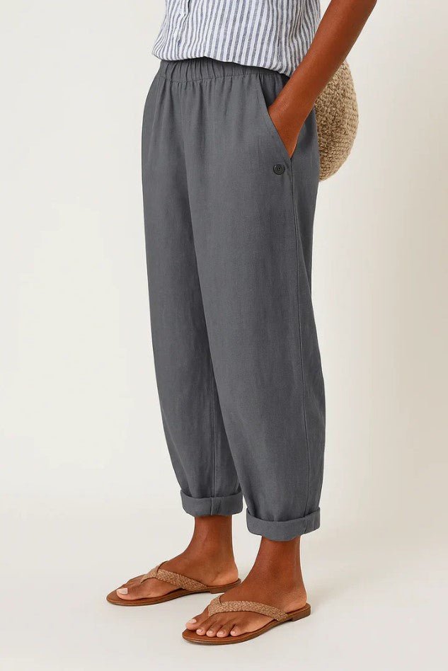 Pantalon femme à taille élastique, coupe jambe large et fluide. Tissu respirant lin-coton pour l'été.