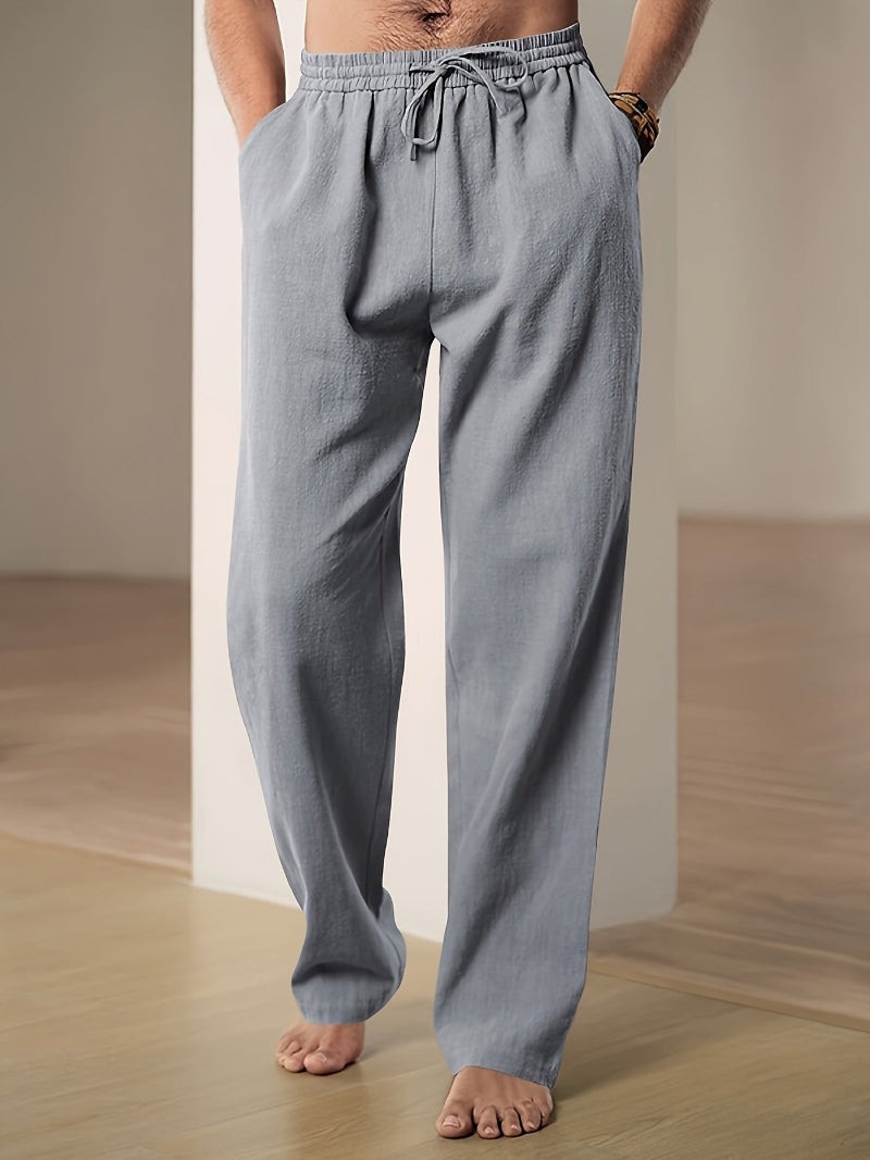 Pantalon homme décontracté, taille élastiquée et cordon. Ample et confortable pour le quotidien ou les loisirs.
