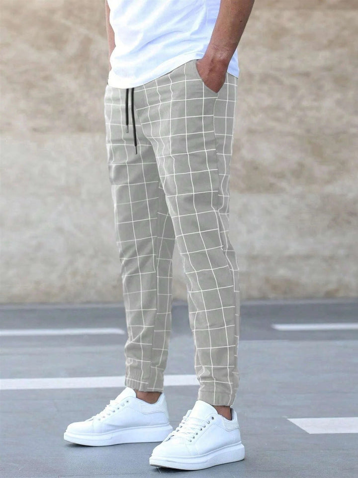 Vêtement casual homme : pantalon de jogging à carreaux polyvalent, doux et stylé pour toute occasion.
