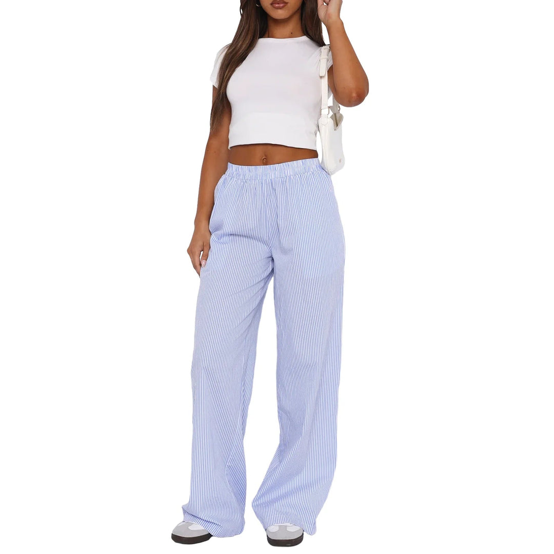 Pantalon de jogging femme mode à rayures verticales, taille élastique. Look chic décontracté et ample.