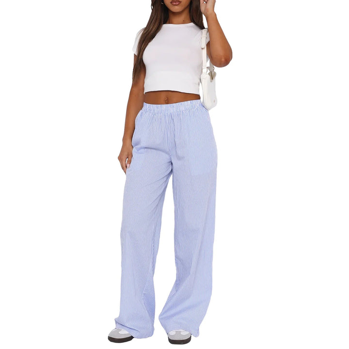 Pantalon de jogging femme mode à rayures verticales, taille élastique. Look chic décontracté et ample.