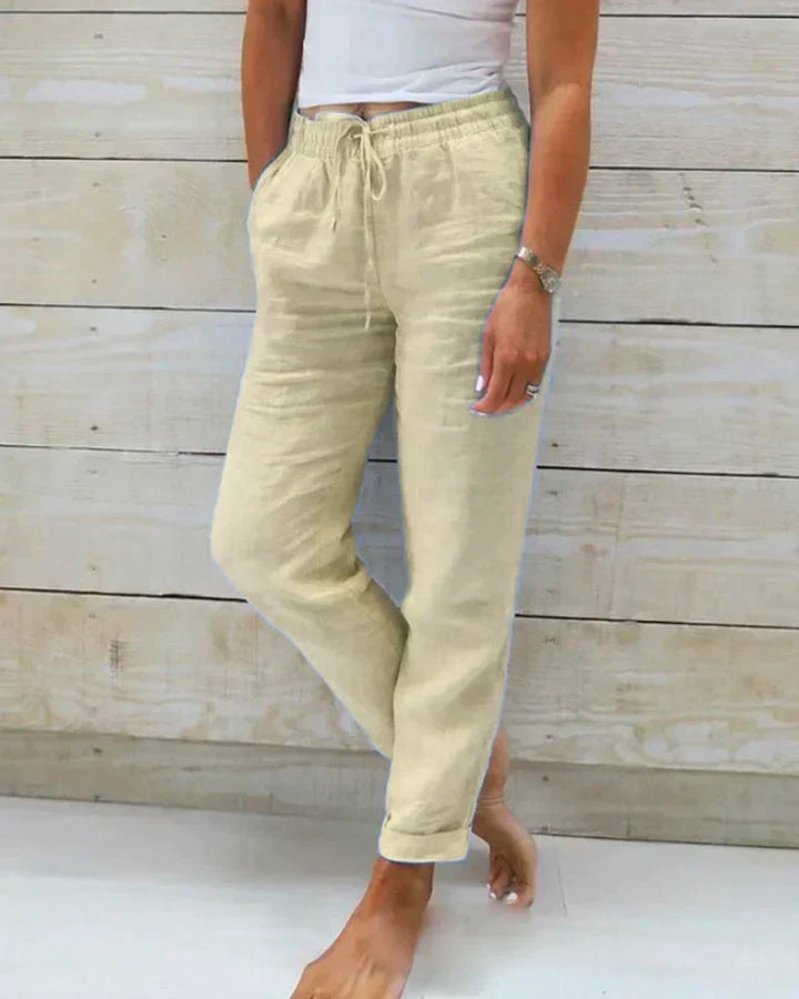 Vêtement femme décontracté: pantalon fluide respirant à taille coulissée pour un confort optimal en été.