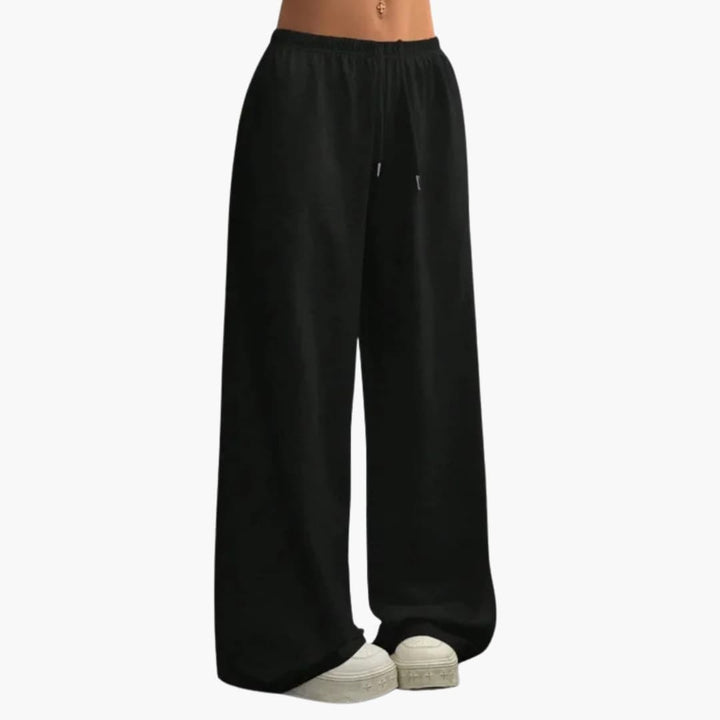 Pantalon taille élastique femme, coupe large et ample, pour un confort maximal et un style féminin élégant.