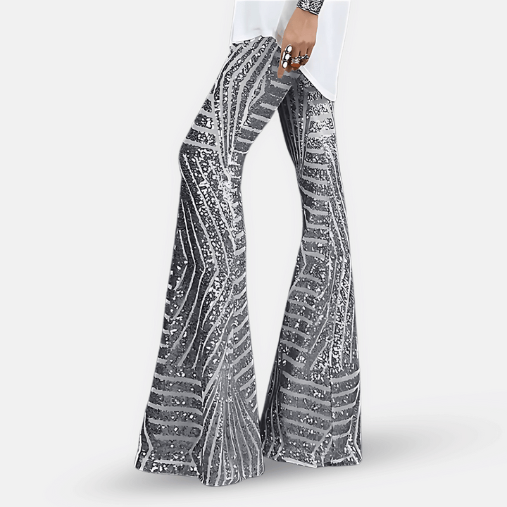 Pantalon glamour femme taille haute, pattes d'éléphant à paillettes pour une tenue festive étincelante.