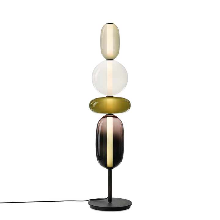 Éclairage décoratif: lampe sur pied en verre coloré, apporte chaleur et style à votre intérieur.