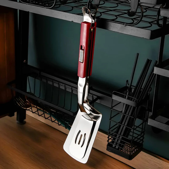 Pince spatule 2 en 1 pour barbecue et grillades. Accessoire de cuisine inox, prise en main facile.