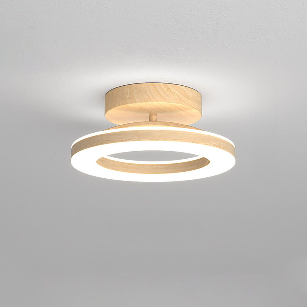 Plafonnier LED moderne à variateur, design disque, apporte une lumière douce et homogène à l'intérieur.