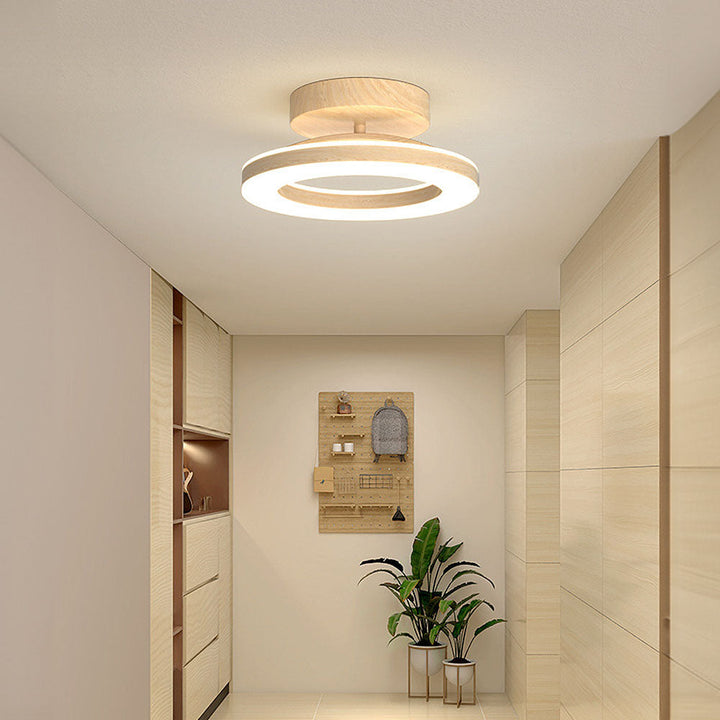 Luminaire LED design pour plafond, disque moderne, offrant un éclairage puissant et économique.