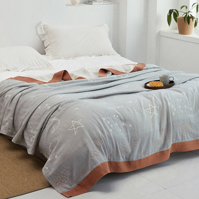 Couverture douce à motif moderne, parfaite pour un canapé ou comme jeté de lit.