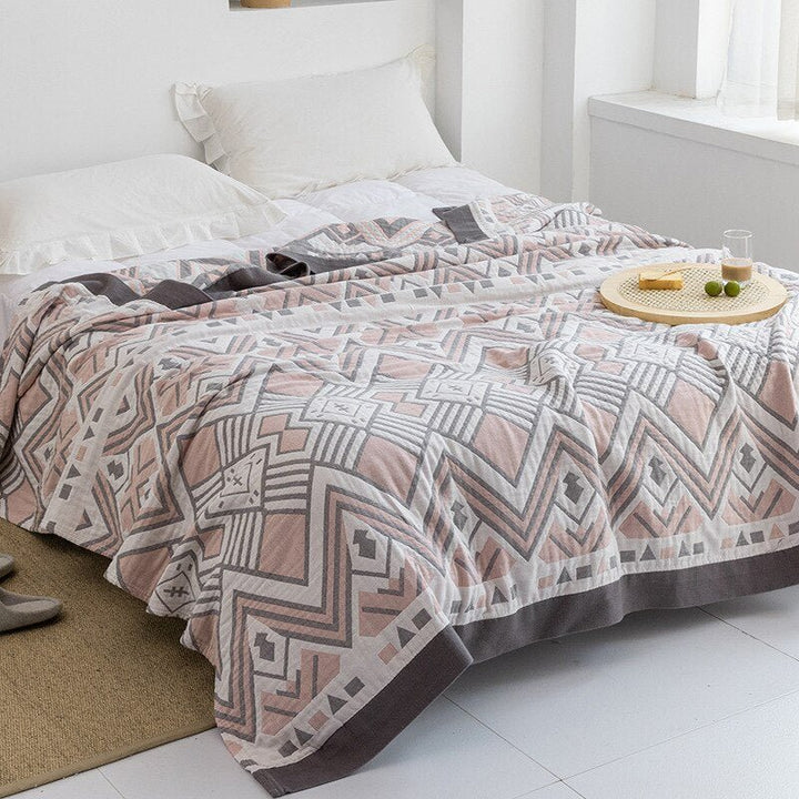Couverture douce et moderne, idéale pour la décoration de votre salon ou chambre à coucher.