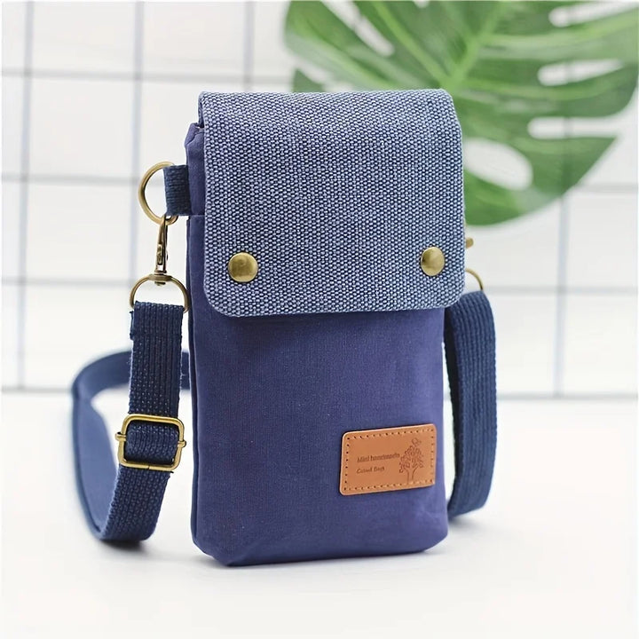 Pochette smartphone femme Linoé en toile, élégante et pratique avec bandoulière réglable pour usage quotidien.