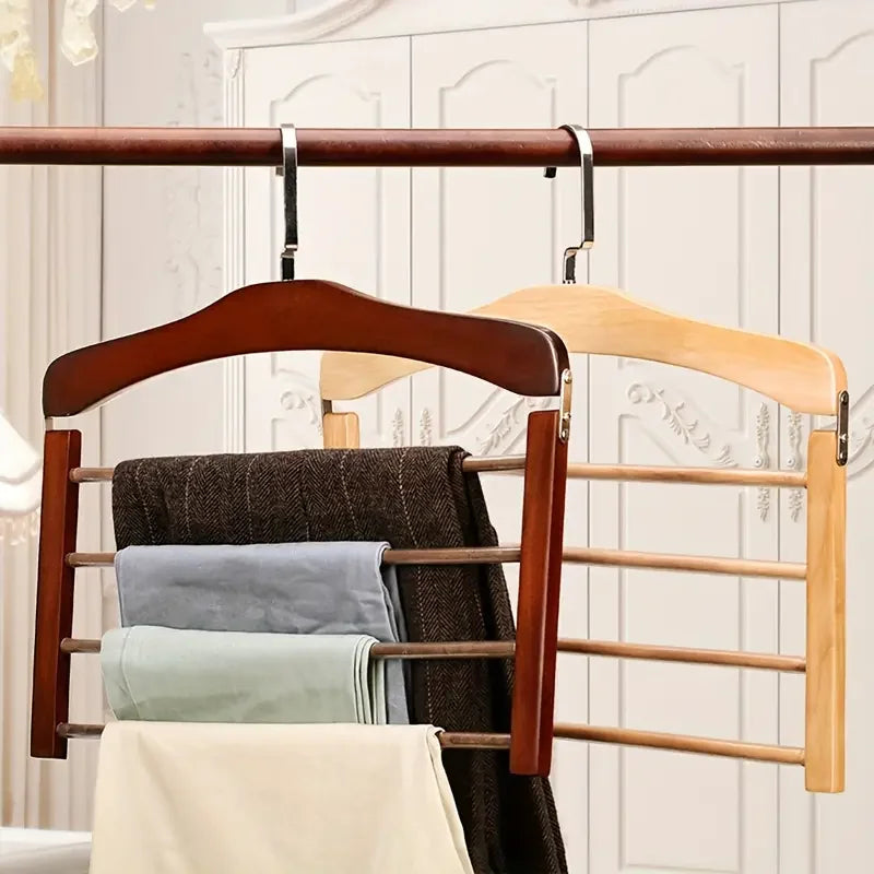 Portant à pantalons en bois de noyer massif. Organisation de penderie avec gain de place et protection antifroissement.