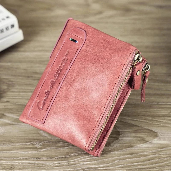 Portefeuille porte-monnaie femme en cuir, avec bouton-pression, pour une sécurité accrue de vos biens.