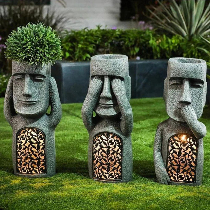 Décoration de jardin solaire : pot à fleurs sculpté visage qui s'illumine la nuit, parfait pour l'extérieur.