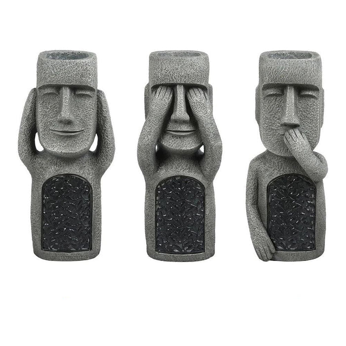 Pot à fleurs extérieur sculpté visage avec lumière solaire intégrée, décoration originale pour tout jardin.