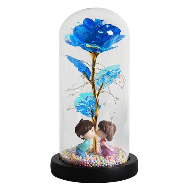 Rose décorative éternelle sous cloche, éclairée par LED pour une ambiance féerique.