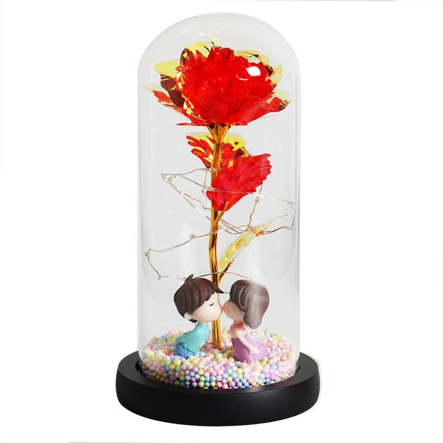 Décoration florale: rose éternelle sous cloche, lampe LED ambiance chaleureuse.