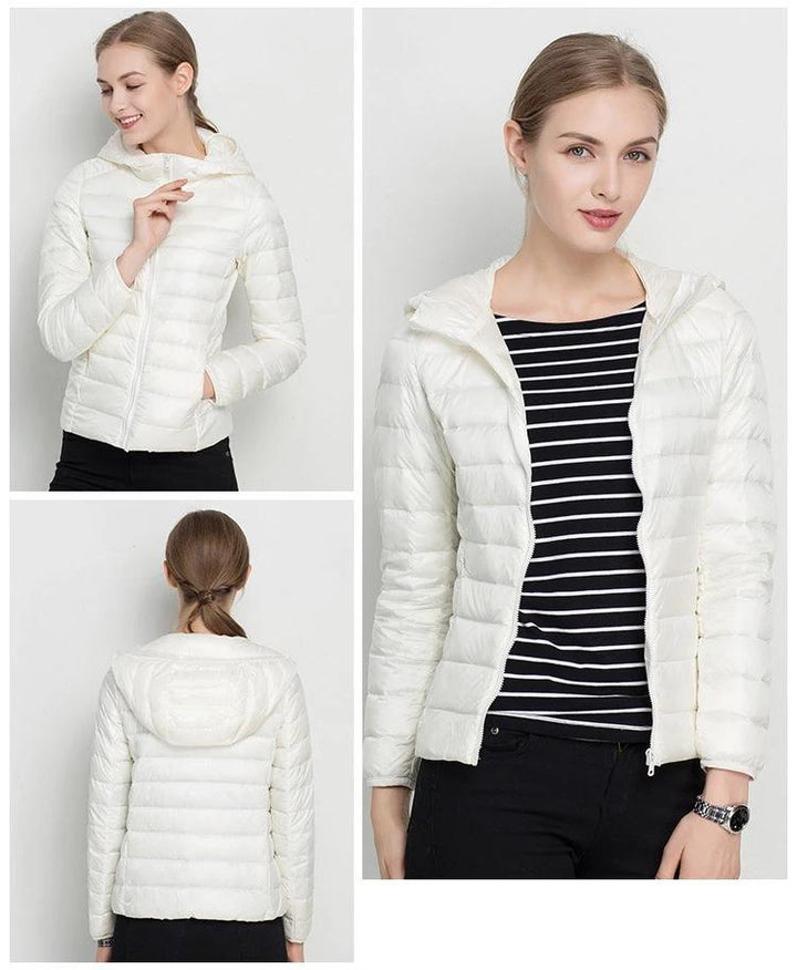 Veste doudoune femme à capuche, coupe ajustée. Légère et confortable, parfaite mi-saison.