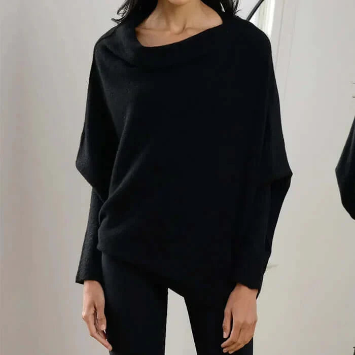 Pull femme chic et polyvalent, coupe drapée asymétrique pour un style moderne.