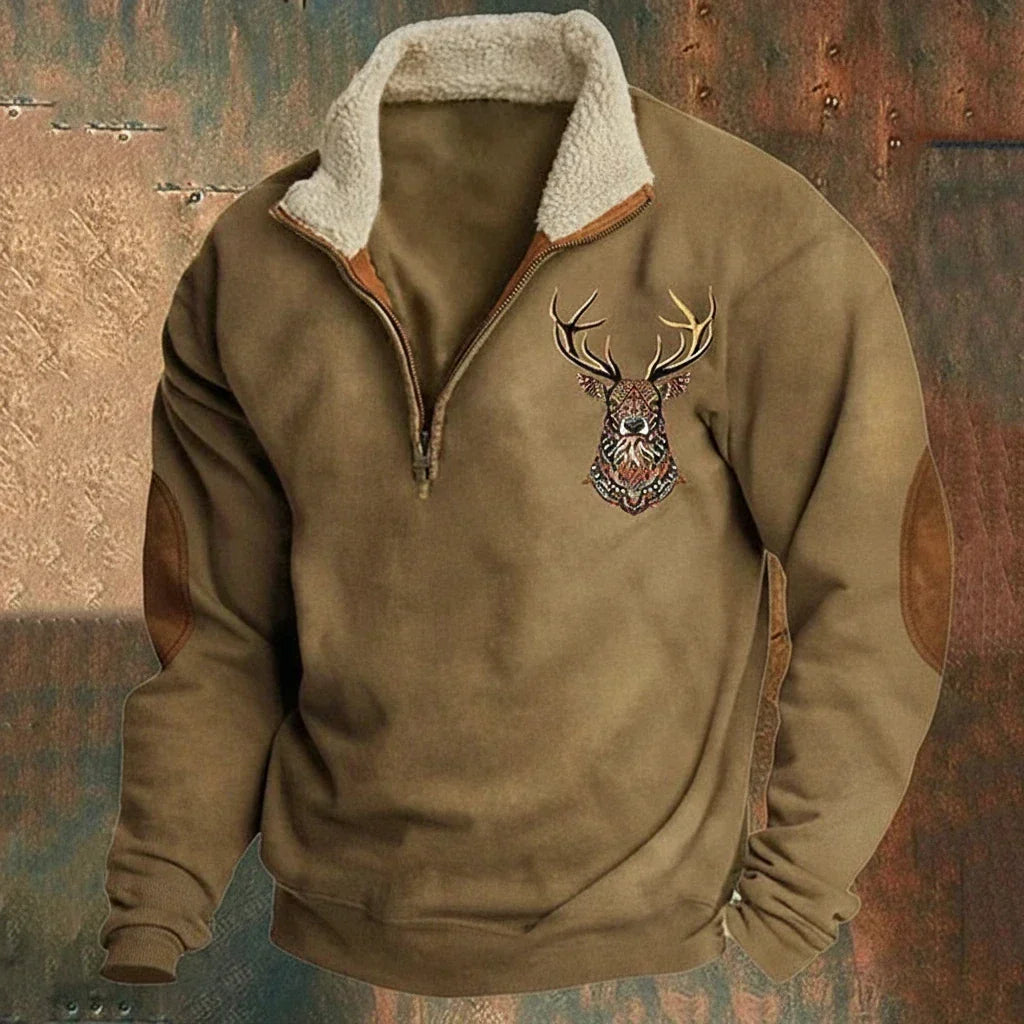 Pull homme half-zip doublure polaire motif cerf. Coudières renforcées pour un style hivernal chaud et confortable.
