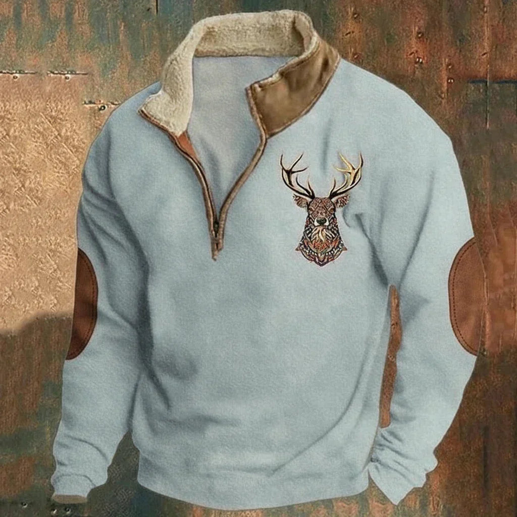 Pull homme confort avec motif cerf et coudières. Half-zip et doublure polaire pour une chaleur optimale en hiver.