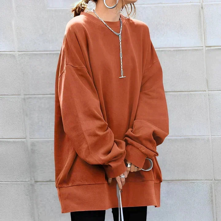 Vêtement confortable : pull tunique oversize femme, texture douce, style décontracté, parfait pour l'hiver et le quotidien.