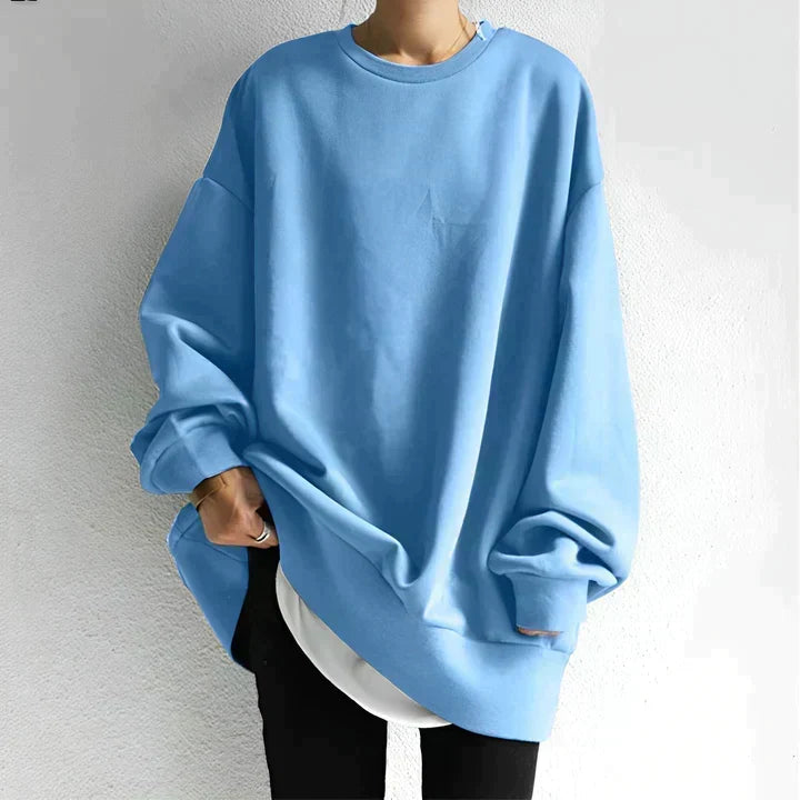 Mode femme : pull tunique à manches longues et col rond, coupe oversize élégante et confortable pour l'hiver.