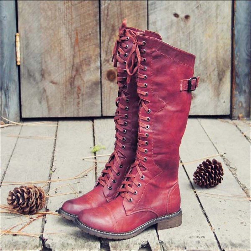 Vue de profil des bottes lacées hautes pour femme, combinant élégance et confort. Parfaites pour le quotidien.