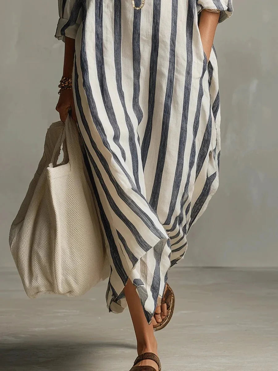 Élégante robe midi femme à rayures printanières, coupe longue ample, dotée de poches, style chic et confortable.