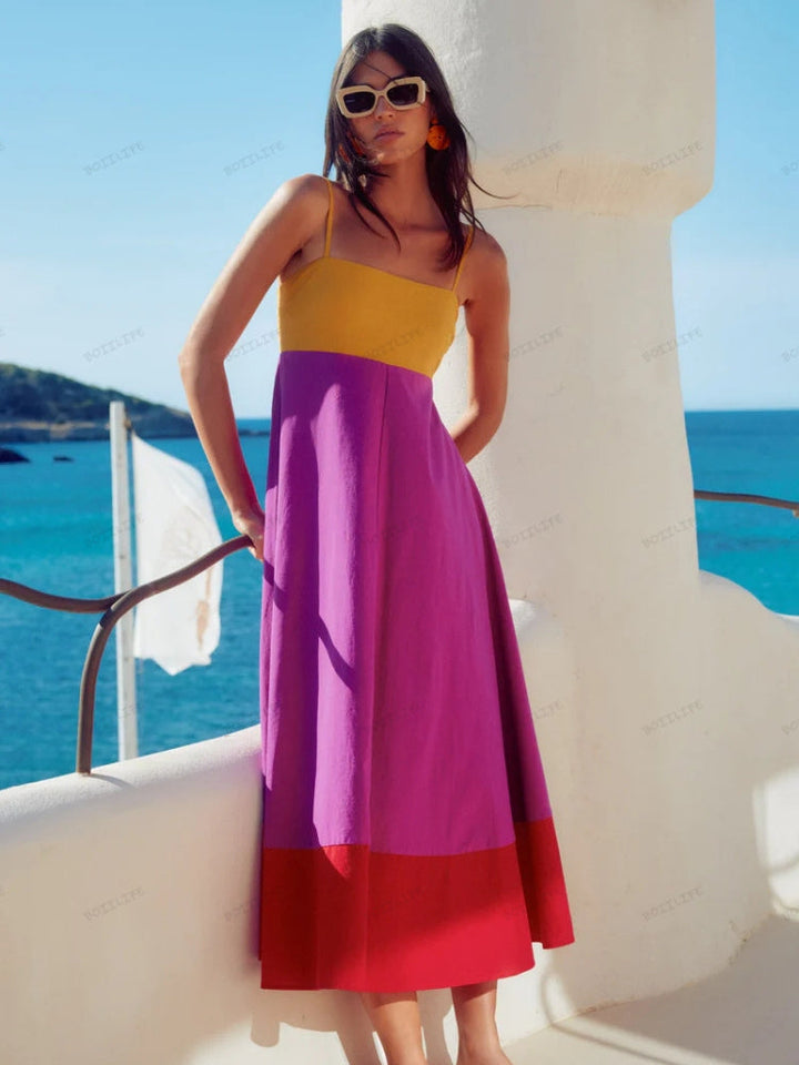 Élégante robe midi color block pour femme avec fines bretelles, un choix chic et polyvalent pour la mode estivale.