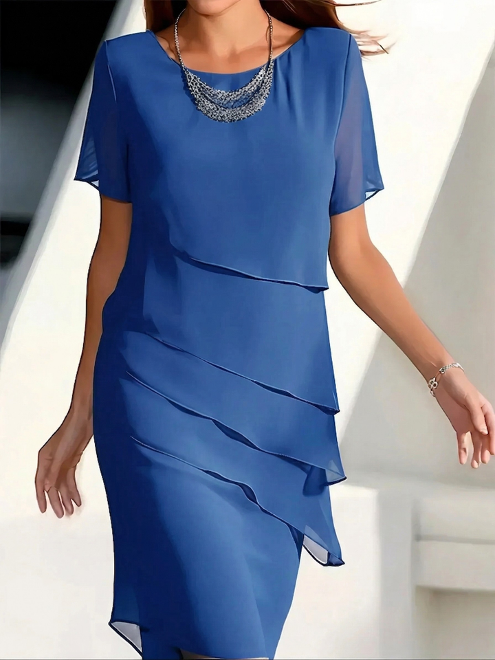 Robe d'été élégante femme, coupe midi fluide et confortable pour un style raffiné au printemps/été.