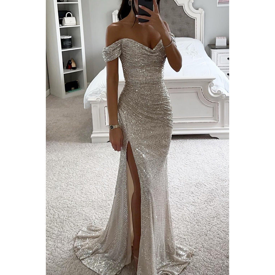 Maxi robe femme élégante à paillettes, coupe longue, épaules dénudées et fente. Idéale pour occasions spéciales.