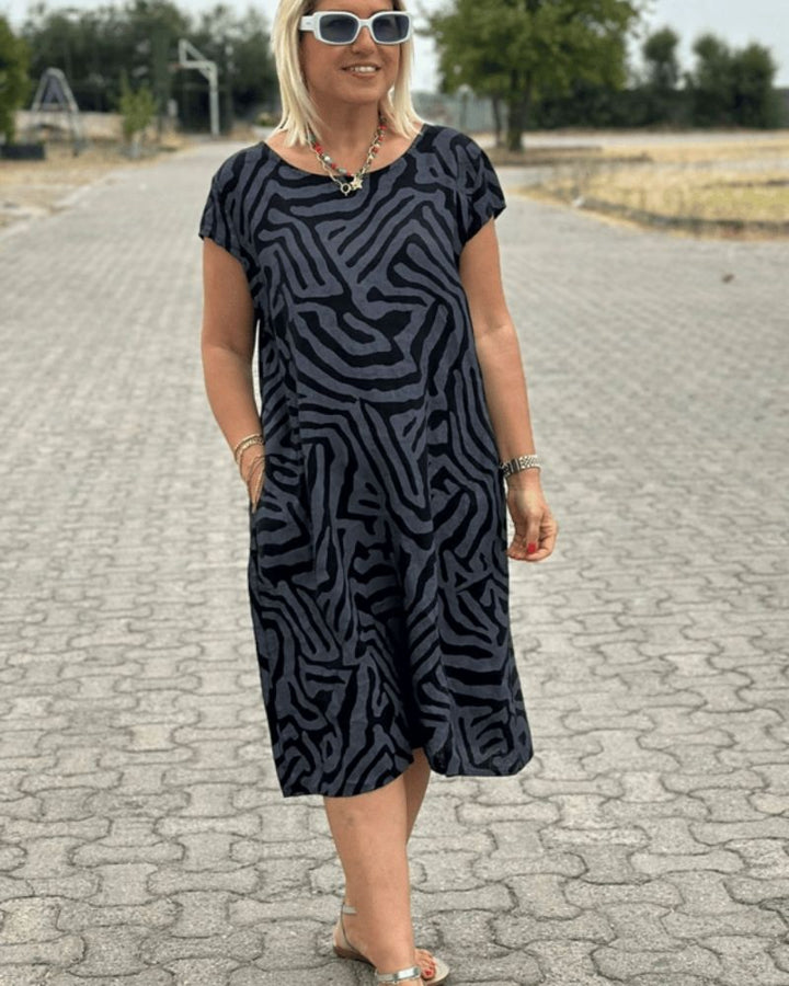 Robe midi élégante et confortable pour femme, col rond. Style polyvalent pour l'été et le printemps décontracté.