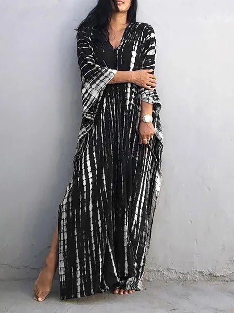 Kaftan fluide femme, motif multicolore, idéal pour les chaudes journées d'été.