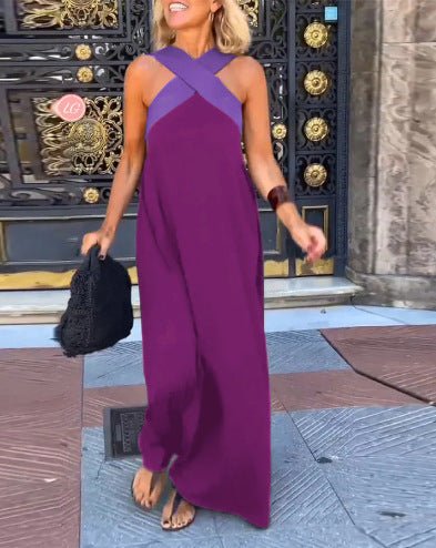 Robe midi femme fluide avec bretelles croisées et col en V, alliant confort estival et élégance décontractée.