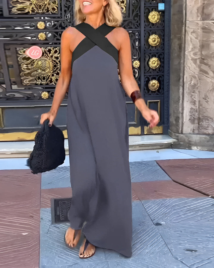 Robe femme élégante et polyvalente, coupe midi fluide, bretelles croisées, col en V, look estival décontracté.