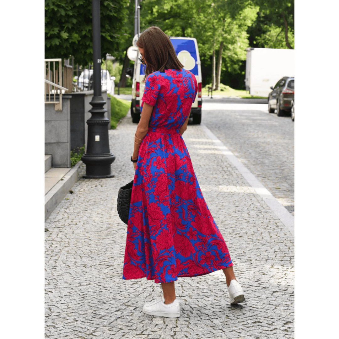 Robe longue fleurie femme, motif floral délicat, coupe évasée. Parfaite pour les journées ensoleillées d'été.