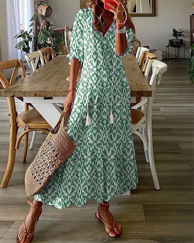 Élégante robe midi femme à motifs géométriques, manches bouffantes, décontractée et tendance.