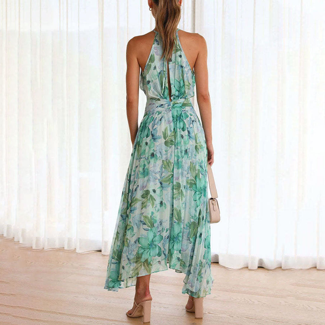 Robe maxi fleurie verte femme, fluide et chic, idéale pour un look élégant en été ou occasion spéciale.