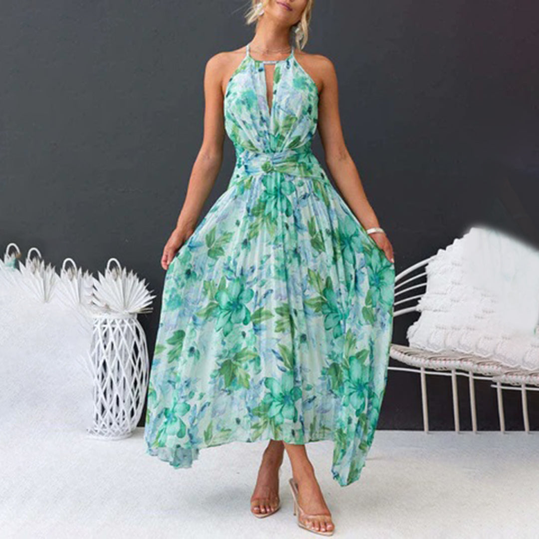 Robe longue fleurie élégante pour femme, motif floral délicat sur fond vert, parfaite pour soirée ou été.