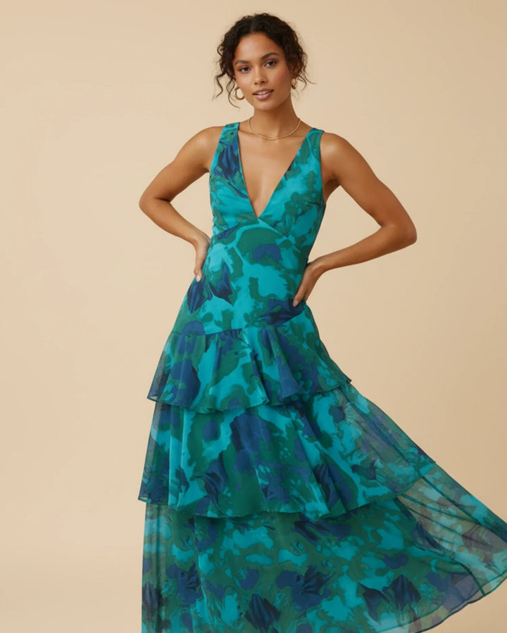 Robe longue femme élégante à imprimé fleuri et volants. Idéale pour le printemps/été, fluide et féminine.