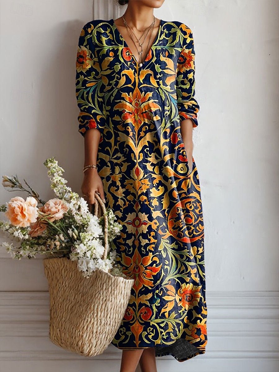 Robe longue fluide imprimée chic pour femme, col en V, manches longues, motif printanier multicouleur, élégance décontractée.