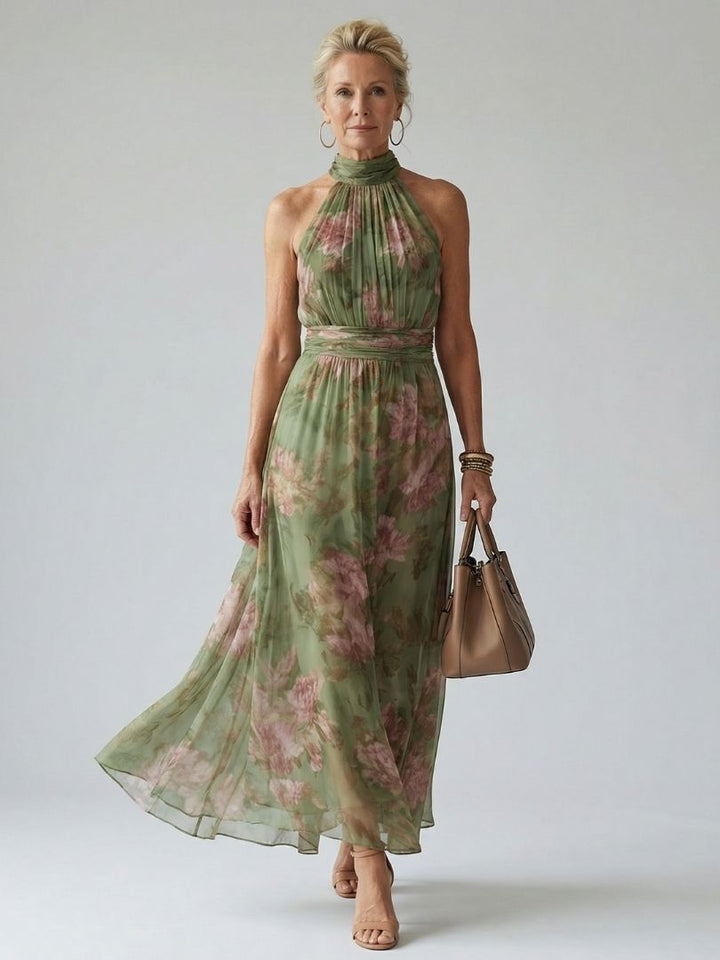 Robe longue fluide femme, imprimé floral vert élégant, style midi chic pour l'été.