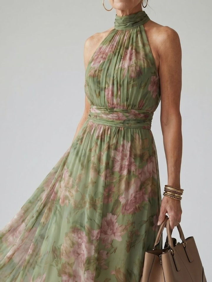 Élégante robe midi fluide à imprimé floral pour femmes, sans manches, ceinturée, mode estivale.