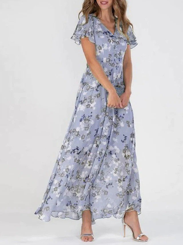 Robe fluide imprimée florale pour femme, coupe trapèze, col en V. Un incontournable estival chic.