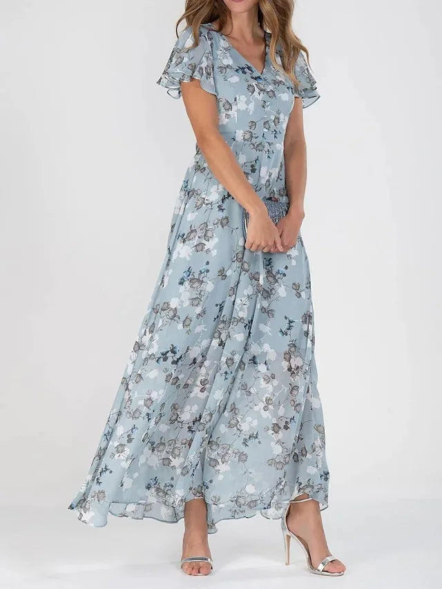 Robe longue femme à imprimé floral, coupe trapèze fluide, col V. Parfaite pour une tenue estivale.