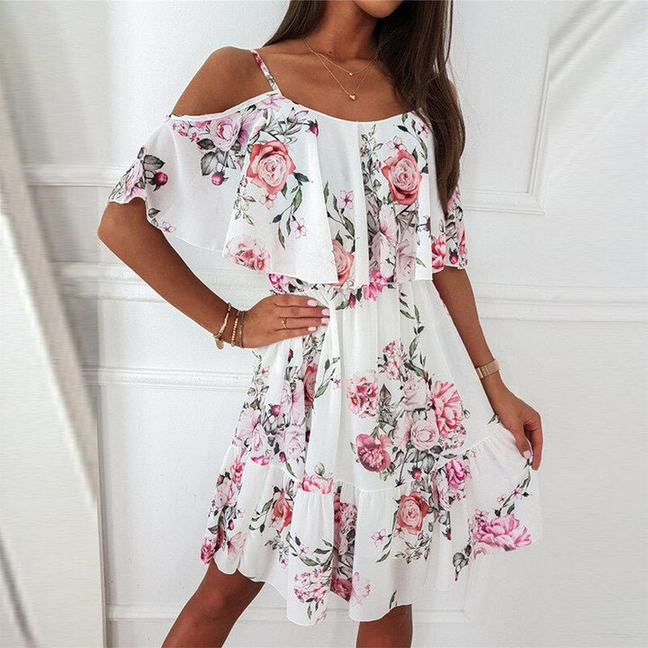 Robe femme mi-longue imprimée fluide avec col V et manches courtes. Confort optimal pour un look d'été décontracté.